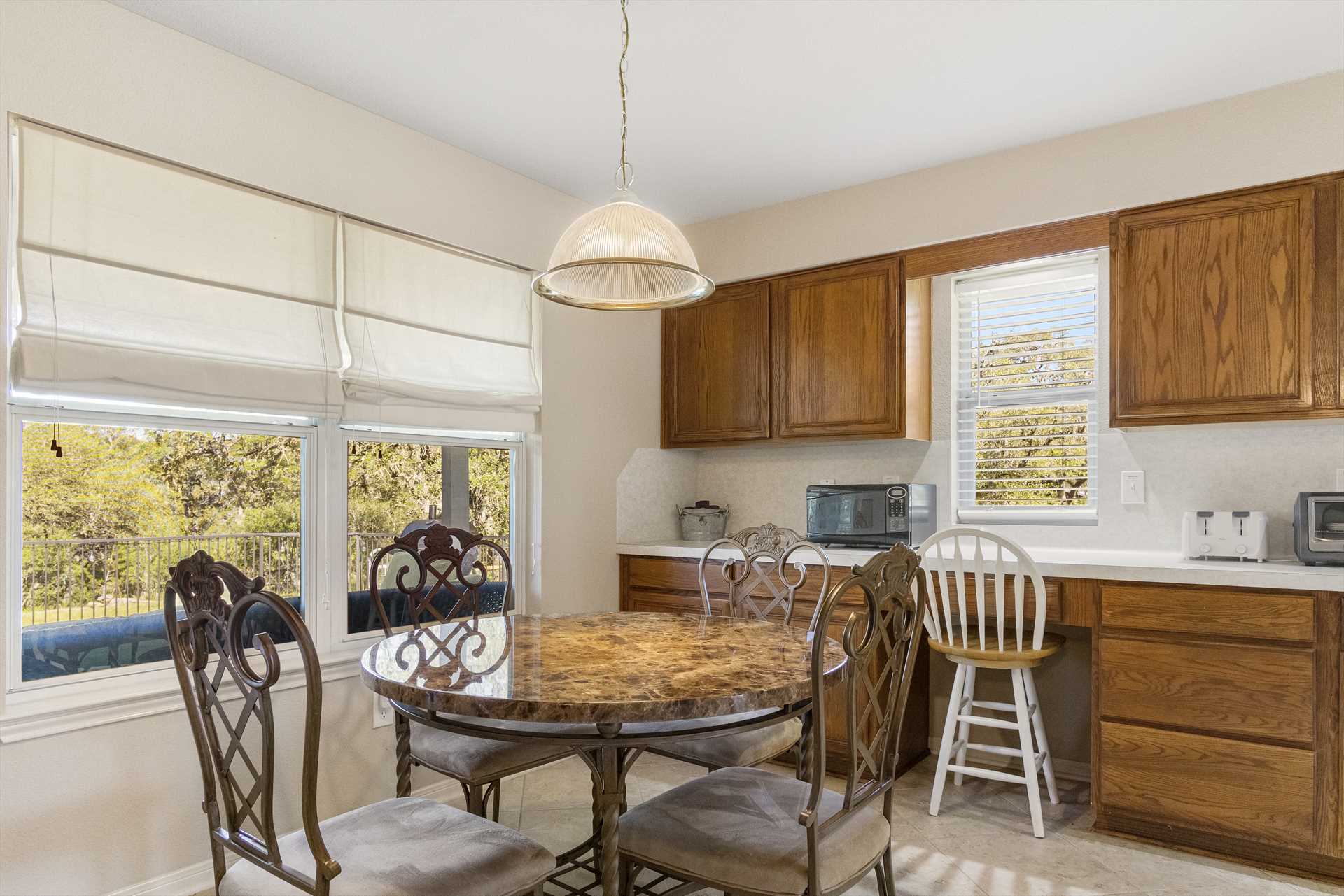                                                 The first dining room table can also serve as a breakfast nook or gaming table, with big windows nearby to allow in natural light and Hill Country beauty!
