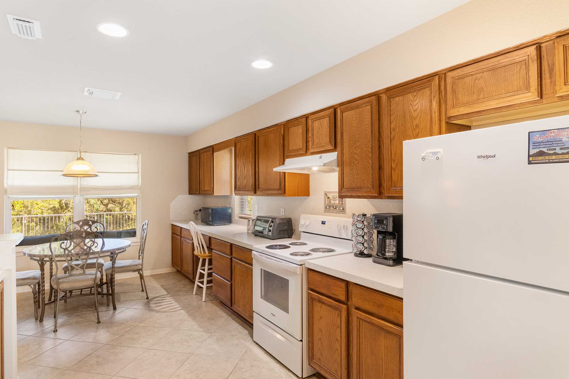                                                 The full kitchen features plenty of appliances, counter space, regular and Keurig coffee makers, and all the cooking and serving ware you'll need at mealtimes!