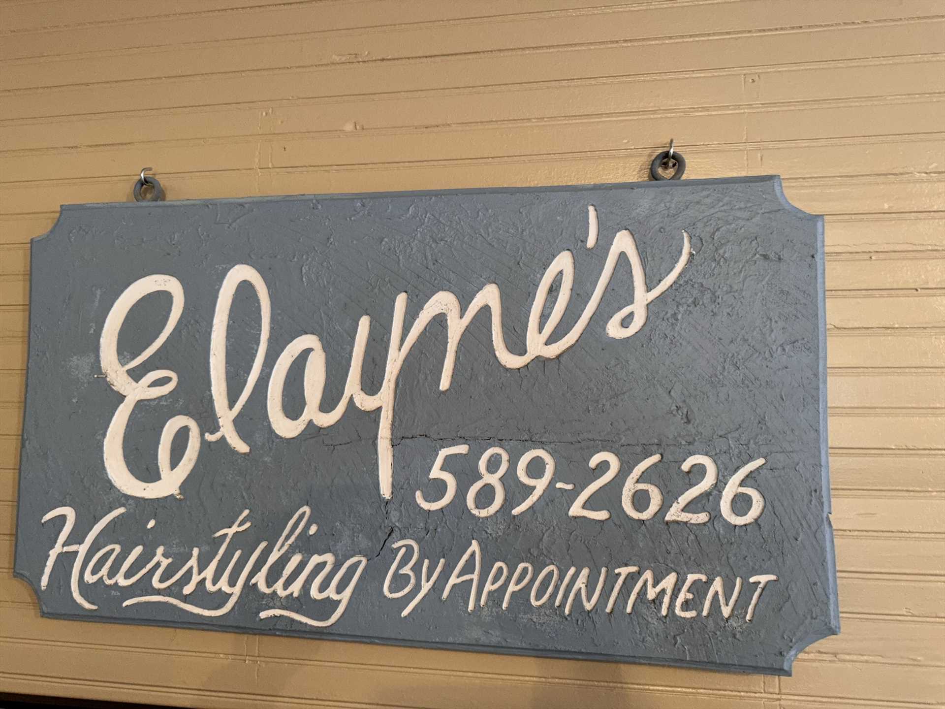                                                 Elayne's original shop sign hangs here, as a tribute to part of the home's happy history in Medina.