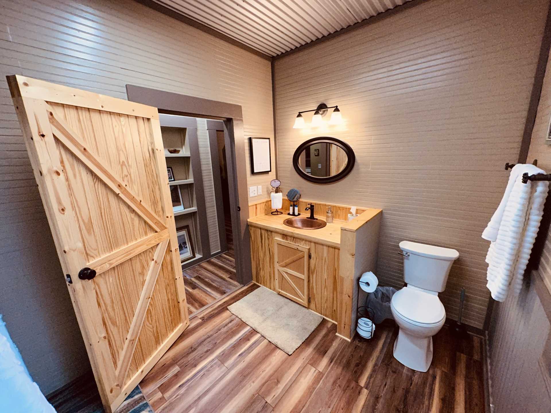                                                 Our guests love the rustic barn door style entryways and cabinets located throughout the cottage!