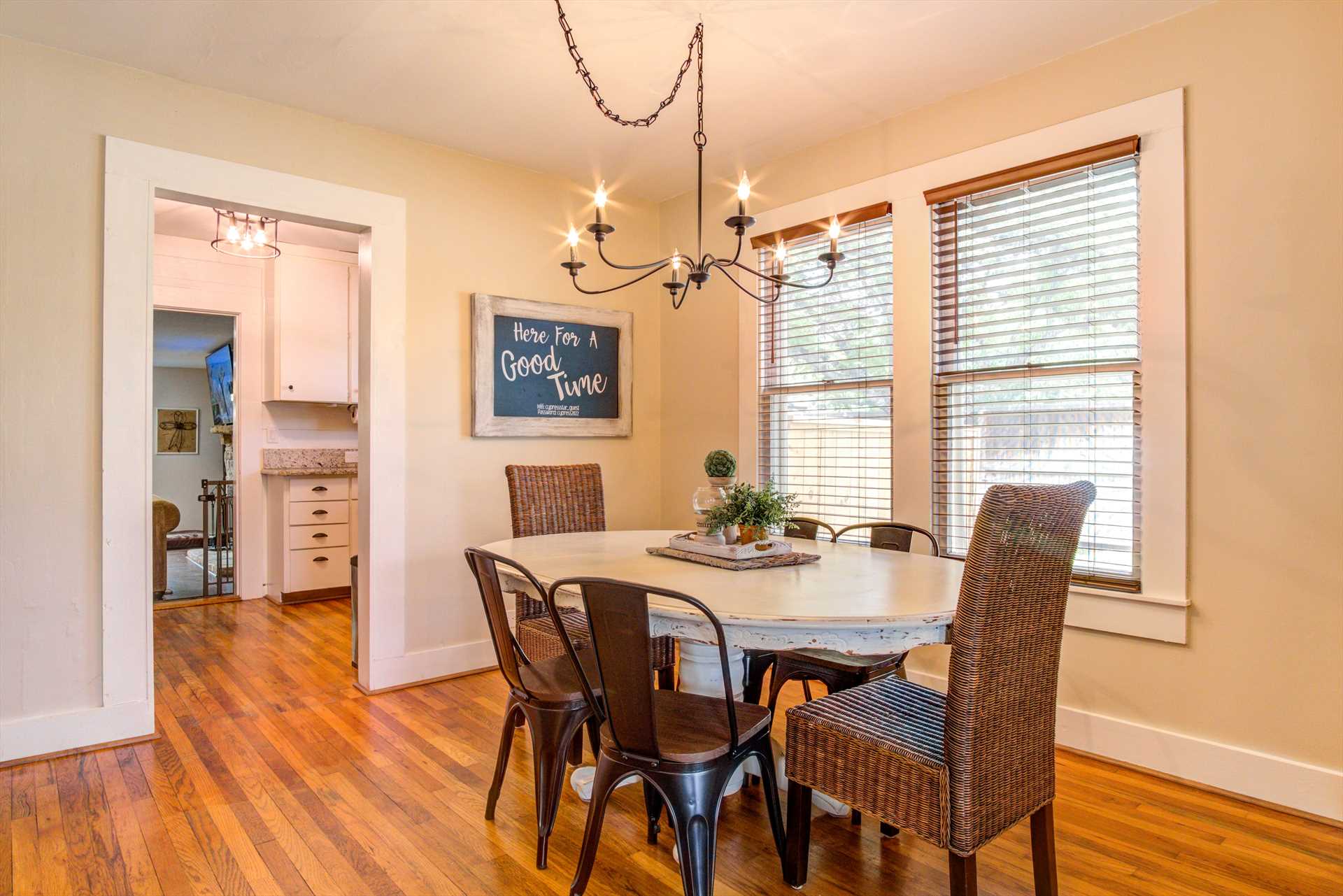                                                 Natural light accents the dining area just off the kitchen, and the table is equally ideal for gaming!