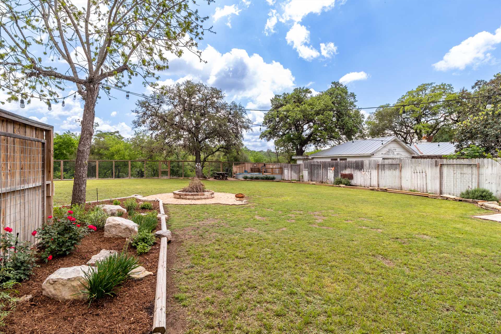                                                 Cypress Star's back yard features a fire pit, where the whole family can enjoy s'mores, conversation, and stargazing!