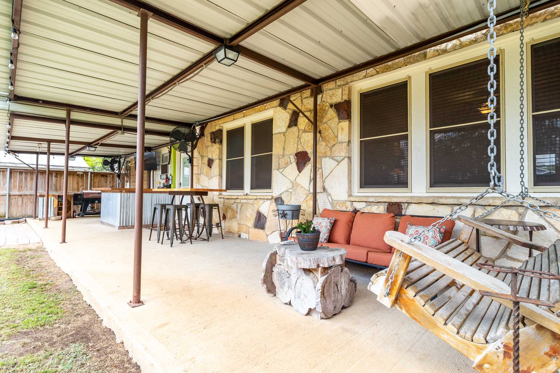                                                 Plenty of comfortable furniture, and cooling Hill Country breezes, await you on the shaded back patio!