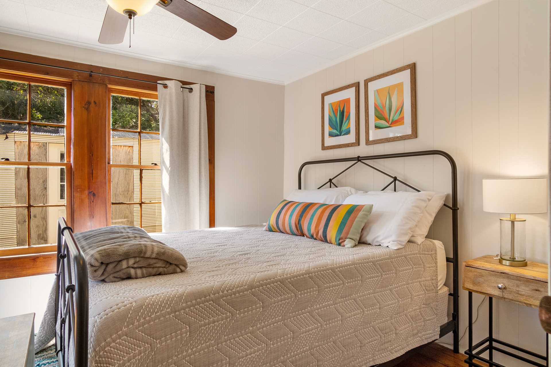                                                 Like the rest of the house, the second bedroom is flooded with natural light, and a roomy and comfortable queen-sized bed.