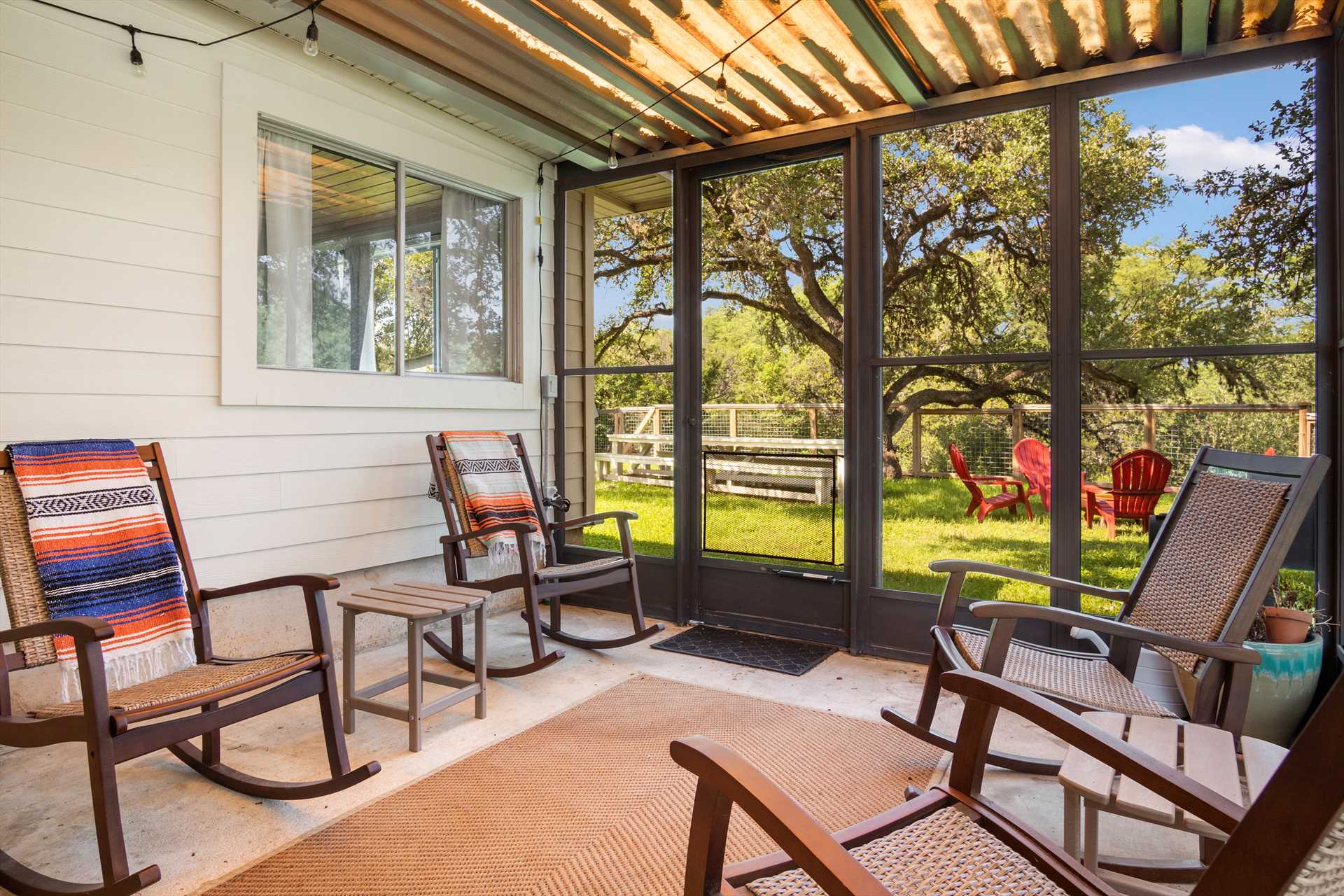                                                 Enjoy a relaxing moment on a rocking chair in the cool breezes of the shaded and screened patio!