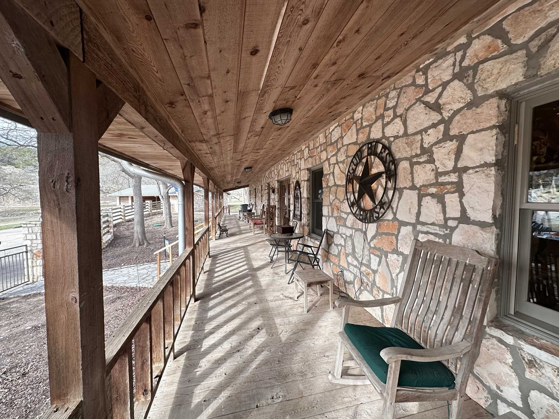                                                 The shaded front porch features outdoor seating for everyone...there's even chairs for the little ones!