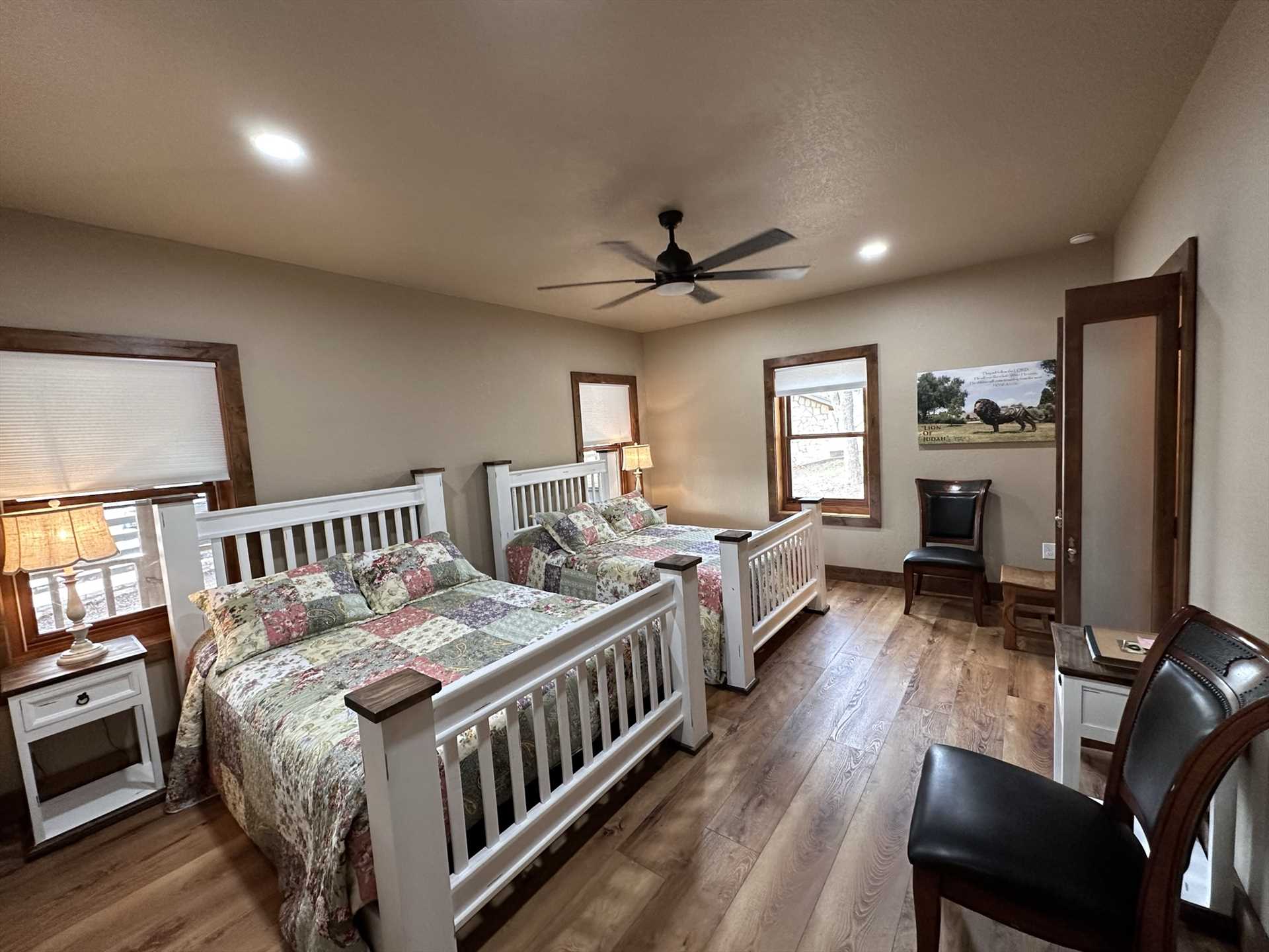                                                 Two plush queen-sized beds with matching woodcraft frames can be found in the roomy master bedroom, and all the sleeping spaces here include clean linens!