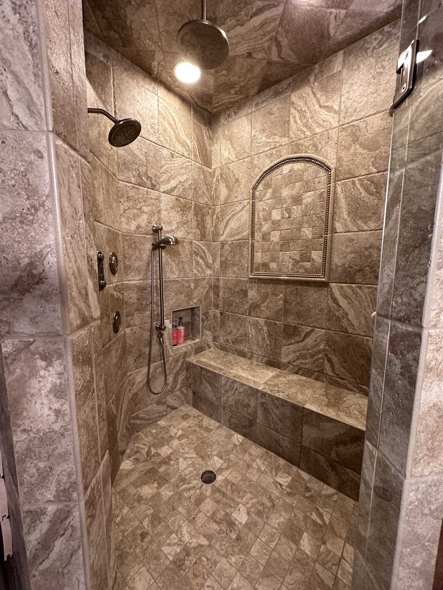                                                 No bumping your elbows during cleanup time when you step into the master suite's enormous shower stall!