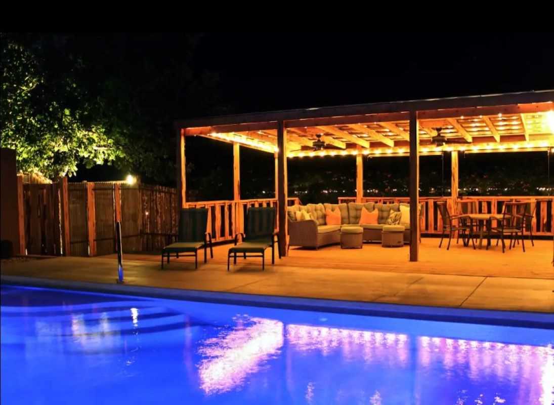                                                 At night, the pool and poolside seating area give off a magical sapphire and golden glow!