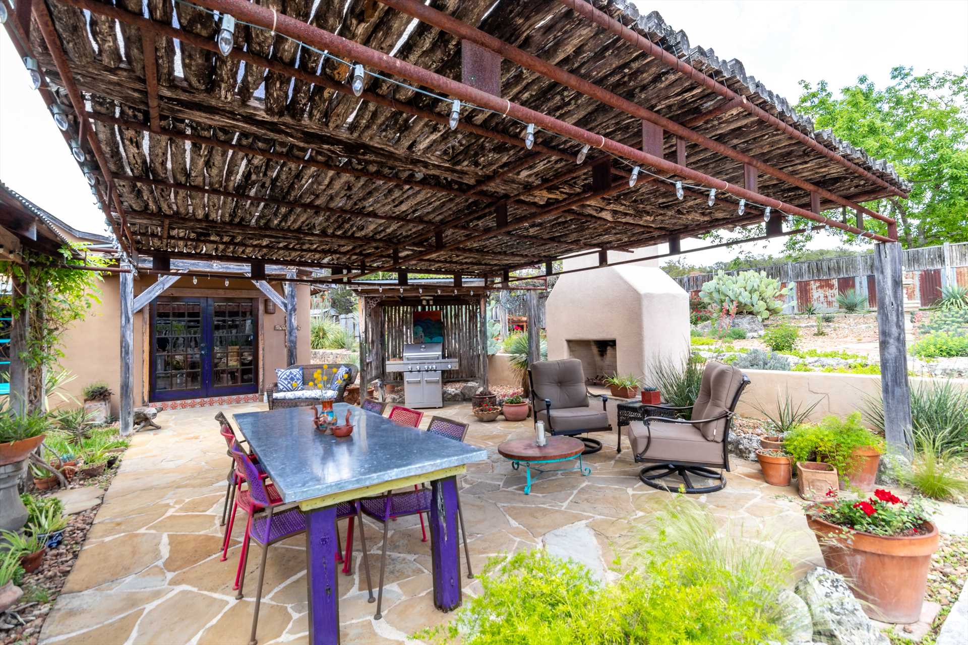                                                 A roomy gas grill and comfortable outdoor dining area are arranged for fantastic and flavorful fresh-air BBQ feasts!