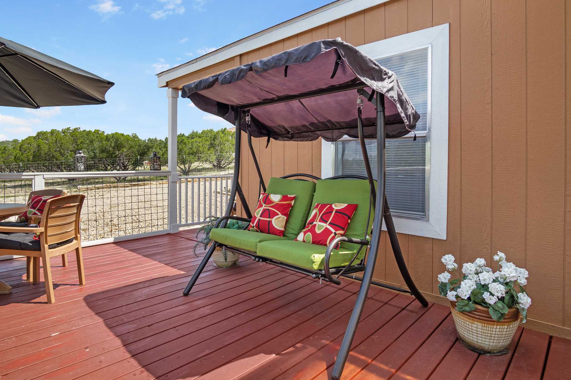                                                 Let the fresh-air breezes waft over you as you enjoy the slow and steady rhythm of the deck swing.