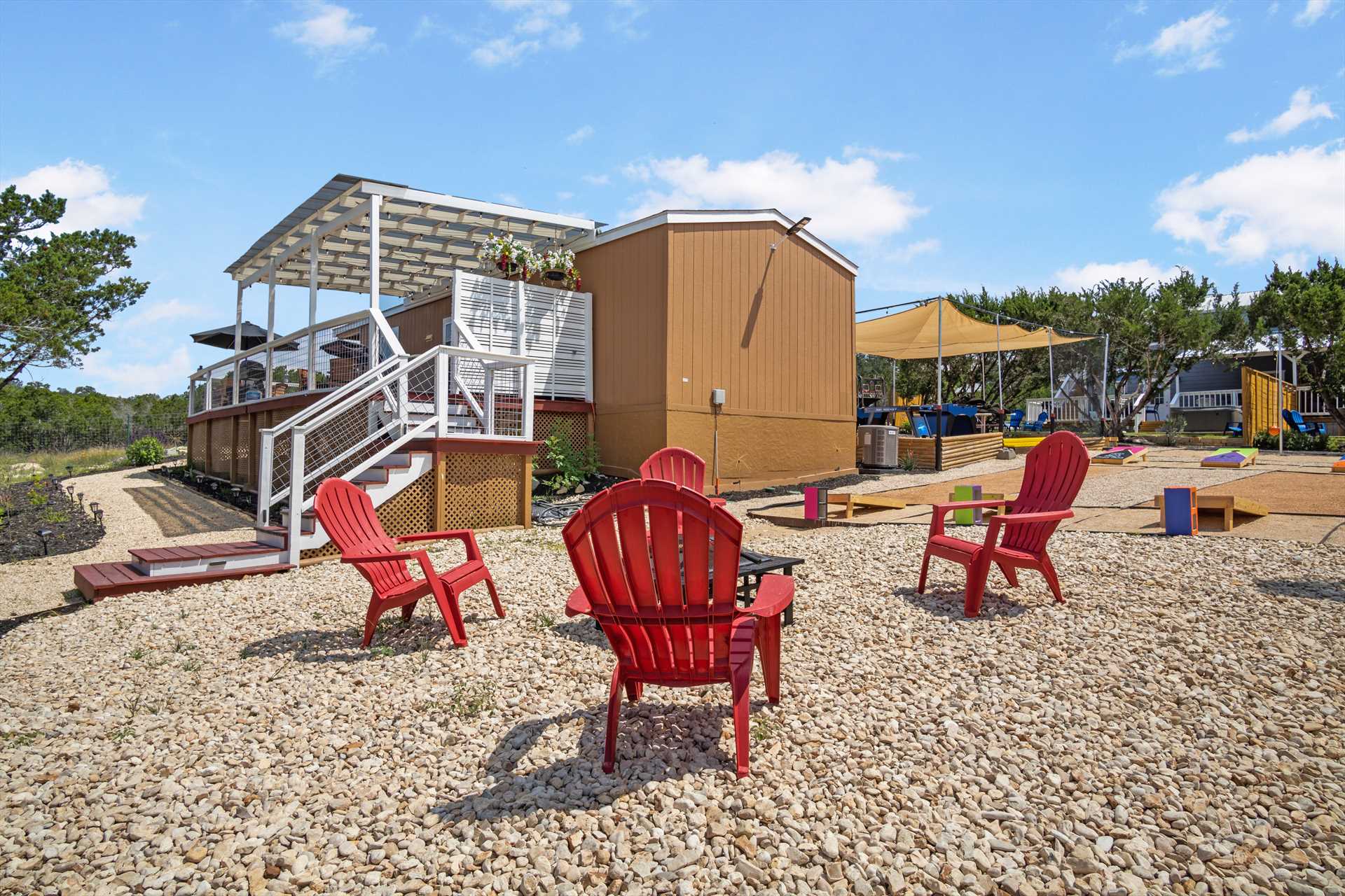                                                 Access to the fire pit and outdoor gaming area is literally right next door to Hill Country Memories!