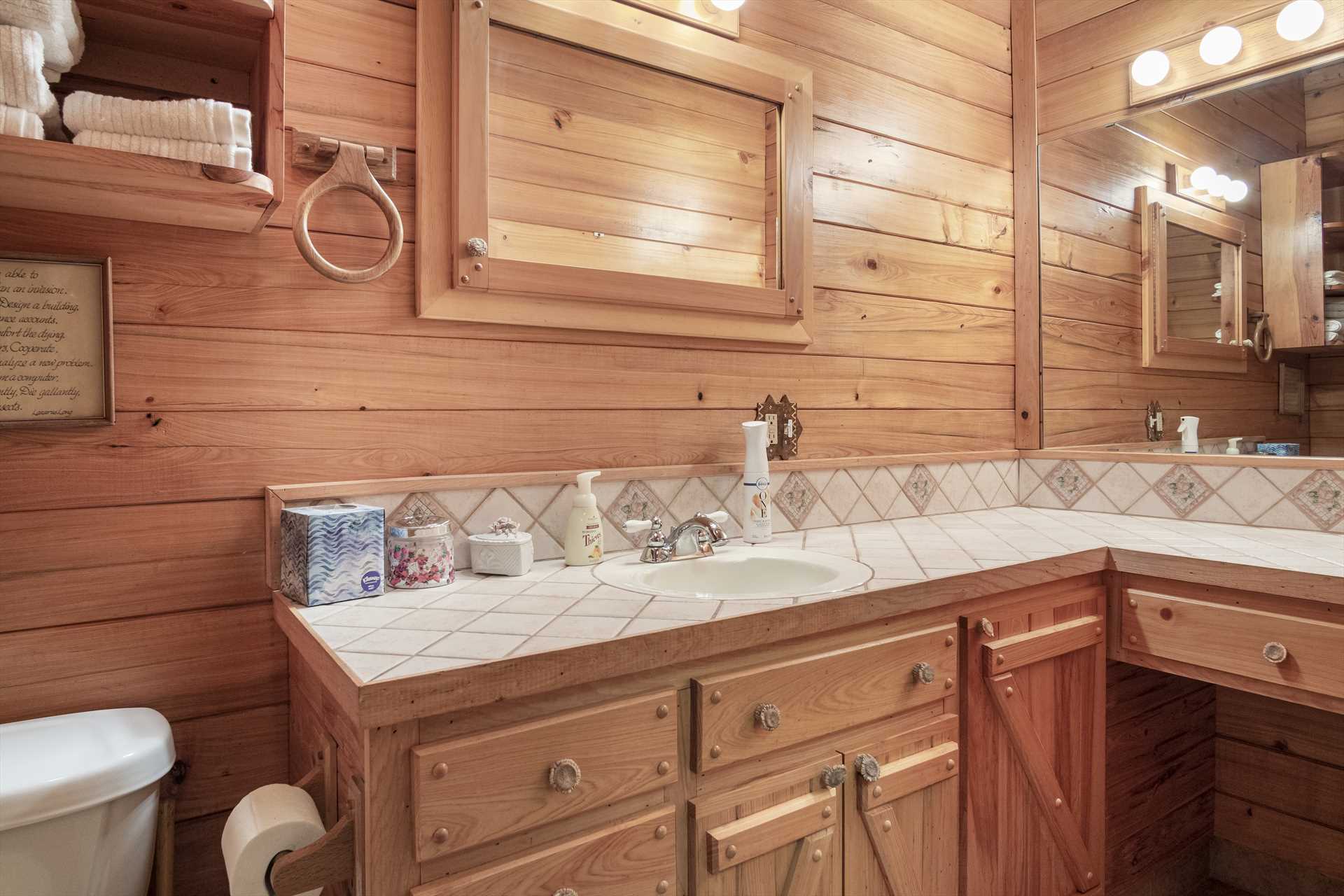                                                There's plenty of toiletry space alongside the vanity in the Whitetail Room's full bath!