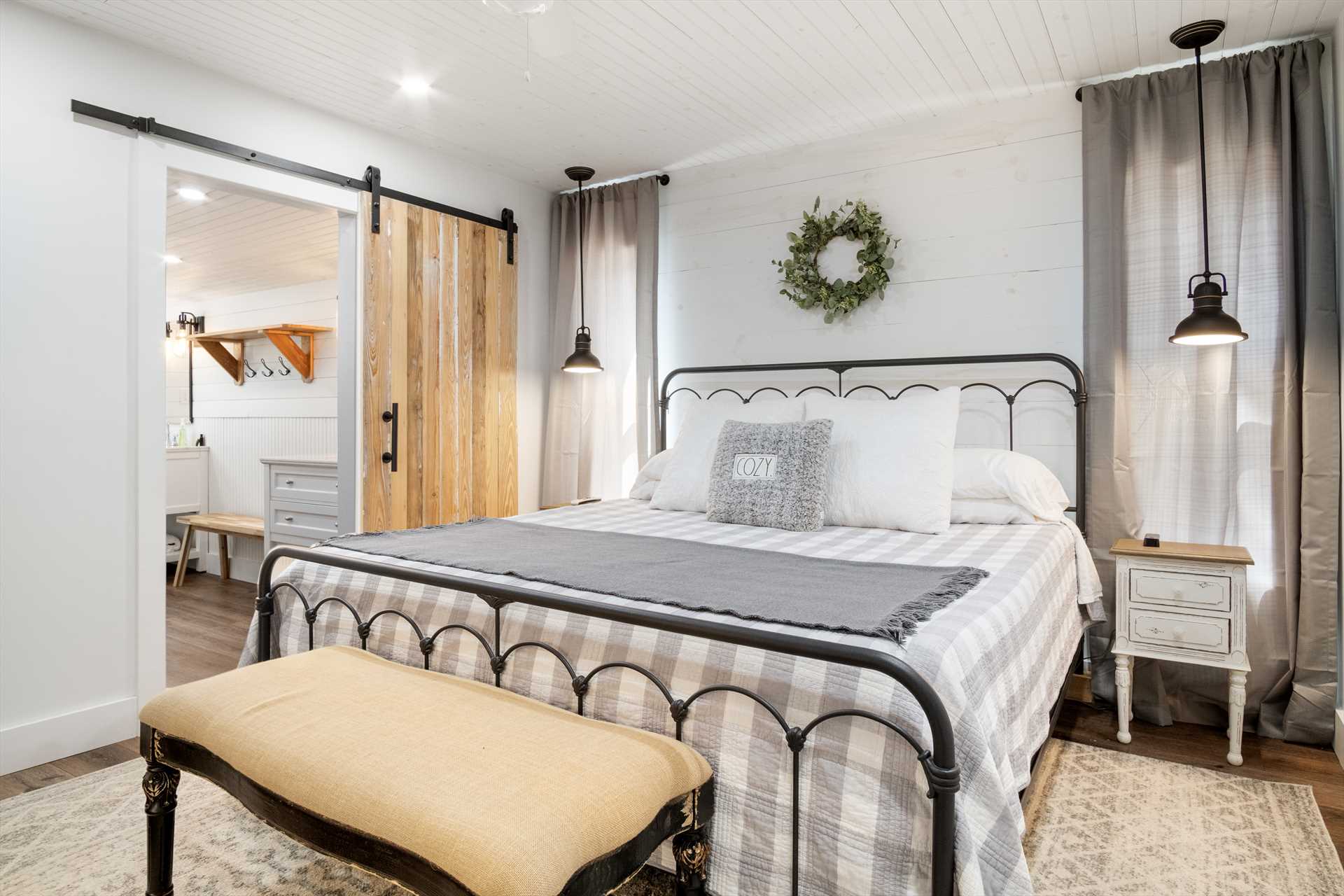                                                 A great big king-sized bed graces the master bedroom, with a full bath completing the en suite.