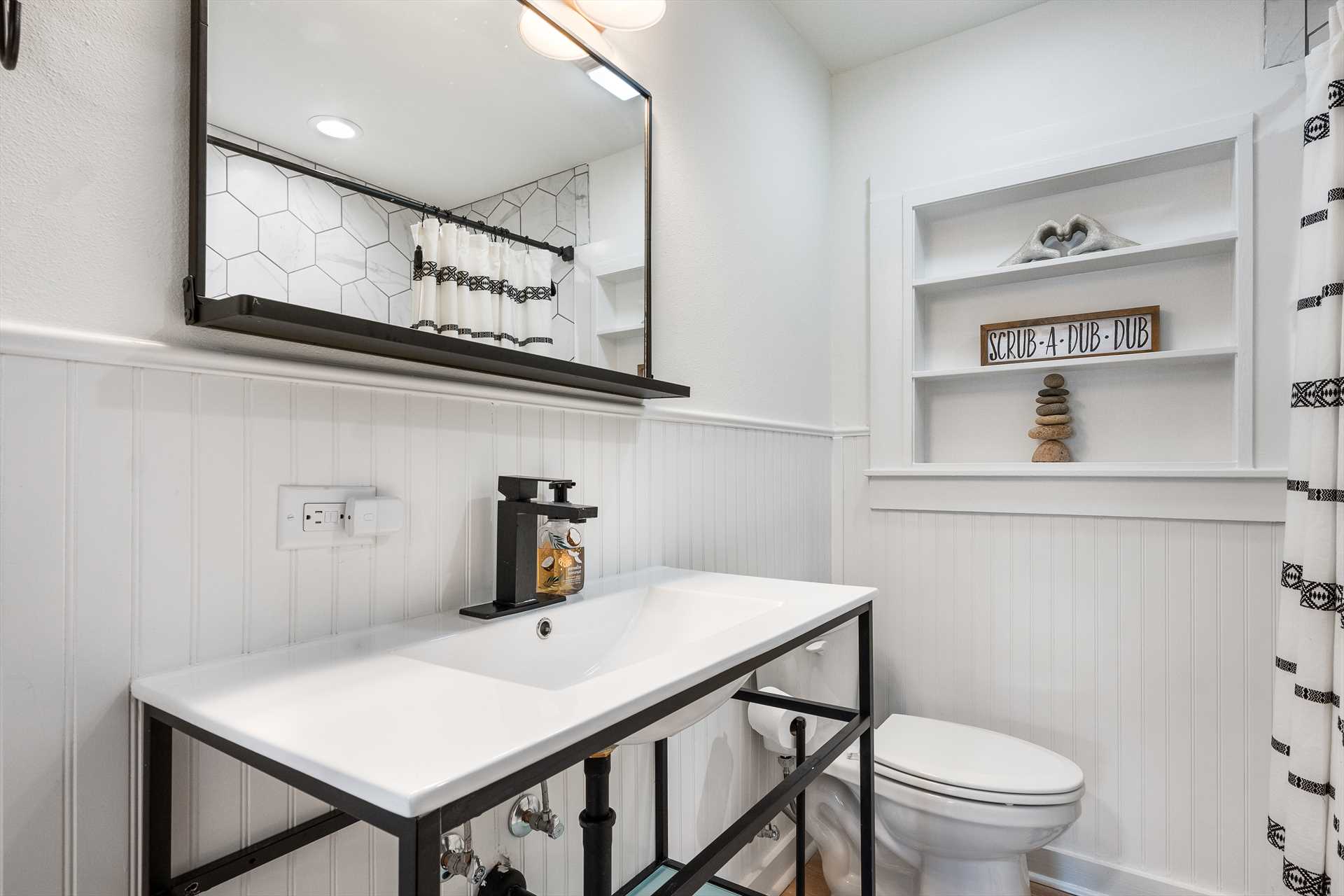                                                 The master bath includes a vanity with plenty of counter space, a shower and tub combo, and fresh and fluffy linens.