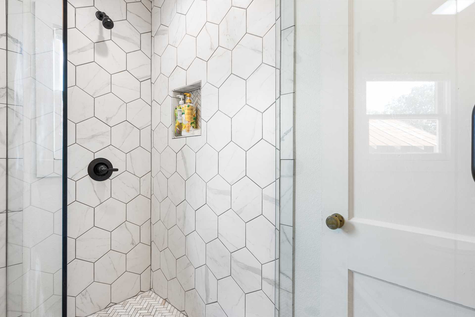                                                 Step in to quick and easy cleanup in the roomy shower stall in the second bath!