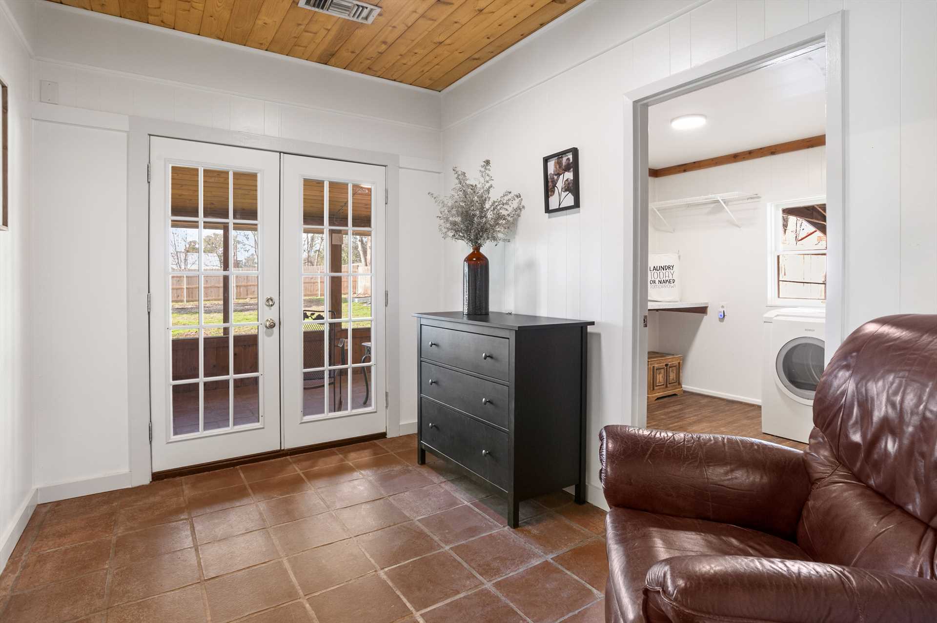                                                 Classic French doors allow entry to the screened-in back porch!