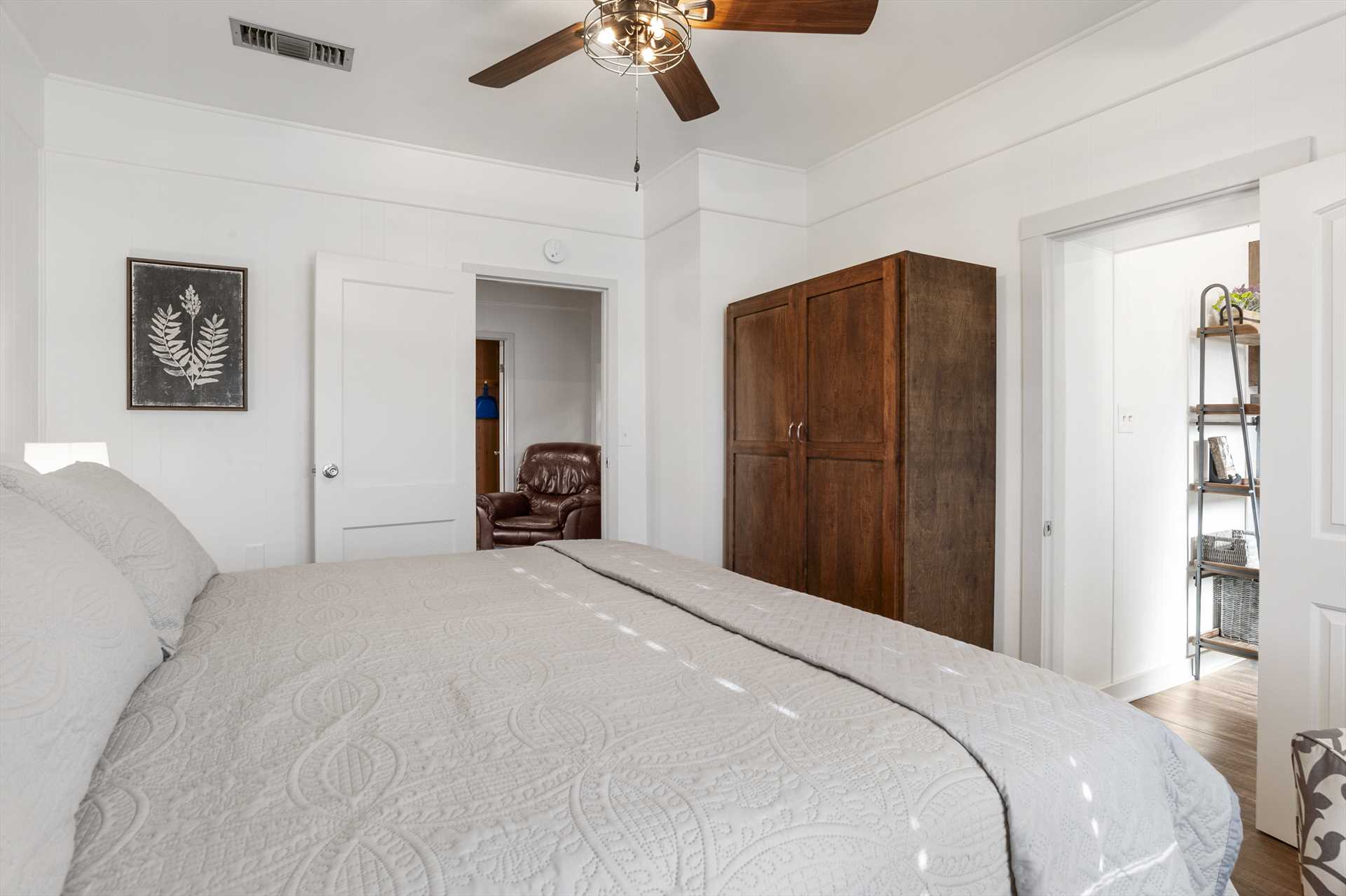                                                 There's a custom armoire for storage in both bedrooms, and the beds are draped in clean linens, too!