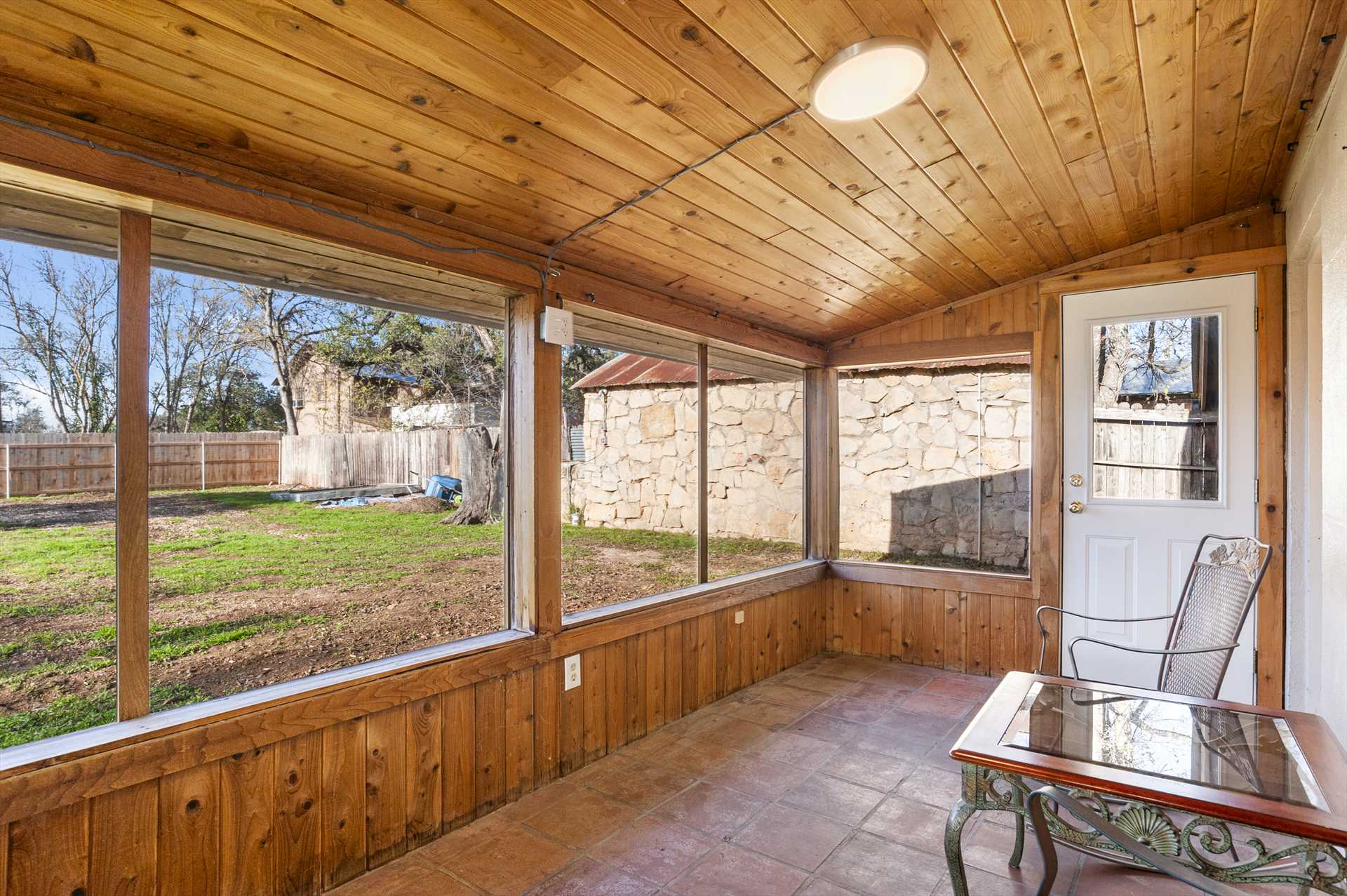                                                 Enjoy Hill Country breezes without invading critters in the roomy screened-in porch out back!