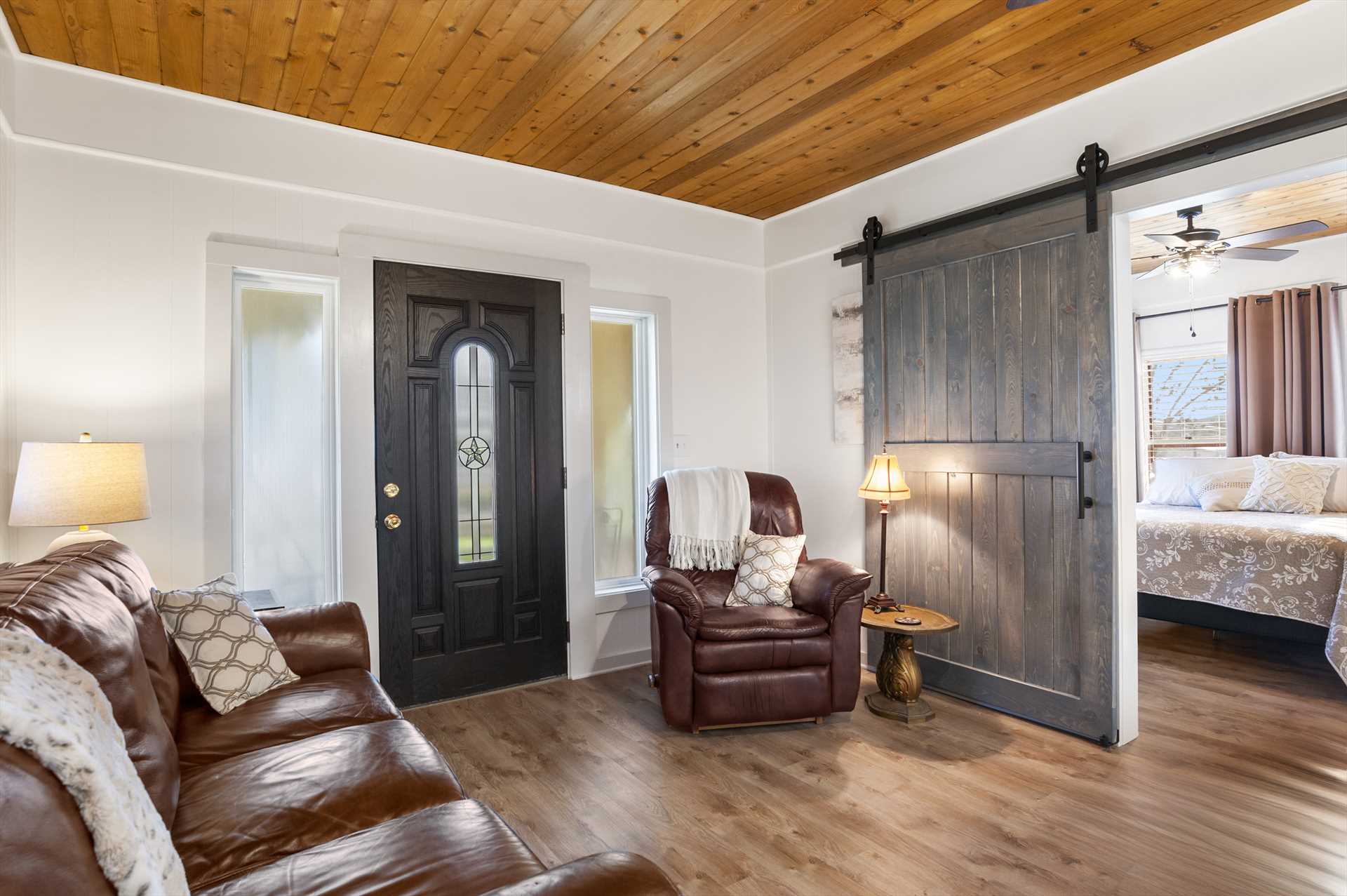                                                 Check out the rustic, yet modern, sliding barn-door entrance to the second bedroom!